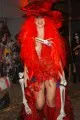 Heidi Klum as a skeleton clad in gaudy red victorian clothing...