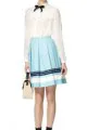 Sheer blouse ($34.99), Canvas skirt ($29.99), Straw bag ($39.99)