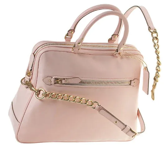 Emily Schuman of Cupcakes and Cashmere Coach pink coach bag