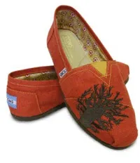http://www.wwd.com/footwear-news/charlize-theron-designs-for-toms-shoes-2398200?justin=2398200