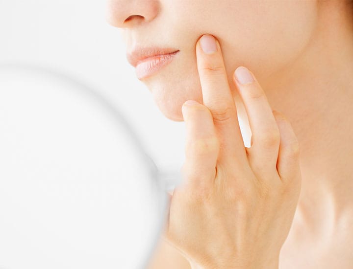 woman-checks-out-skin