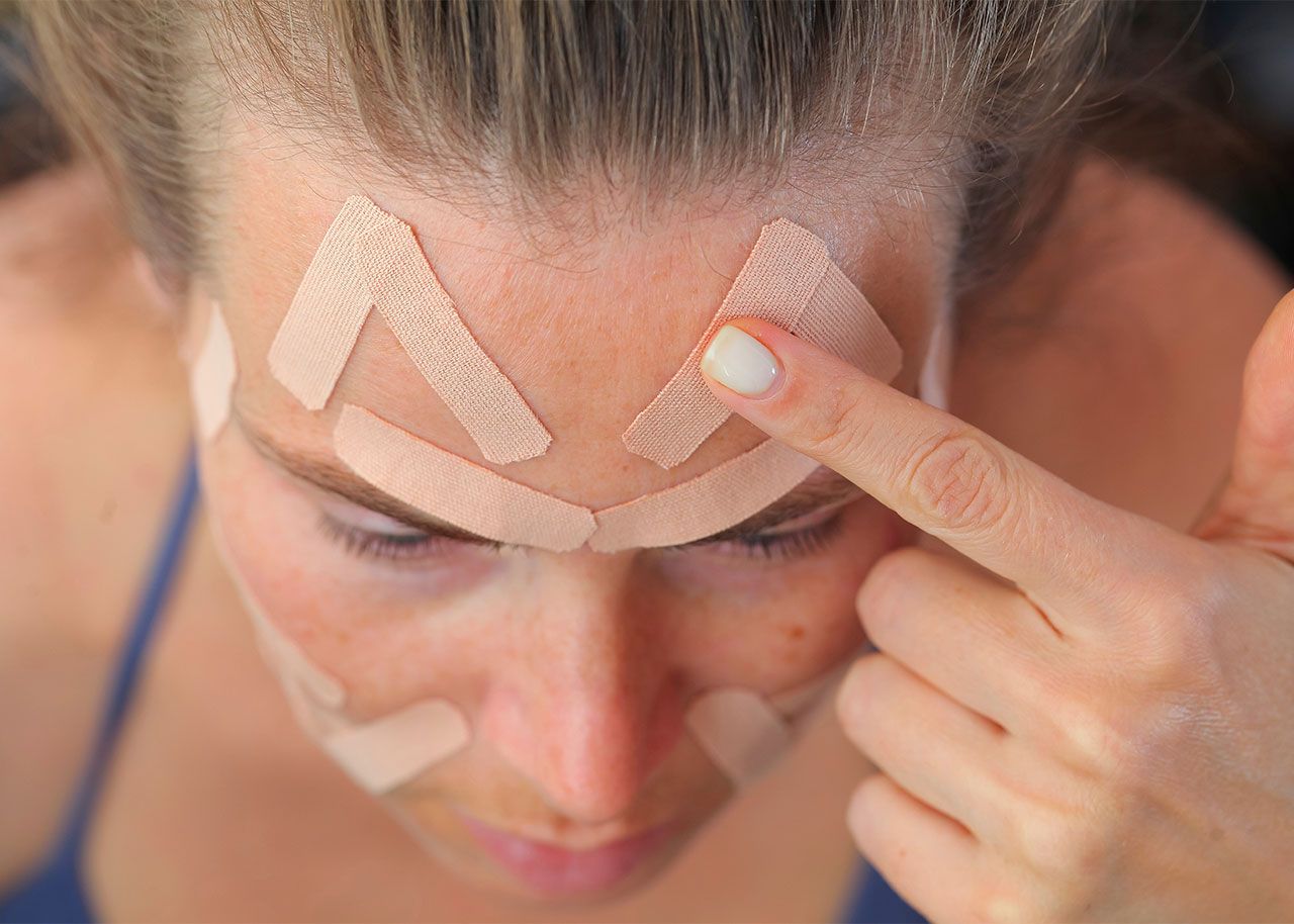 woman-applying-wrinkle-face-tape