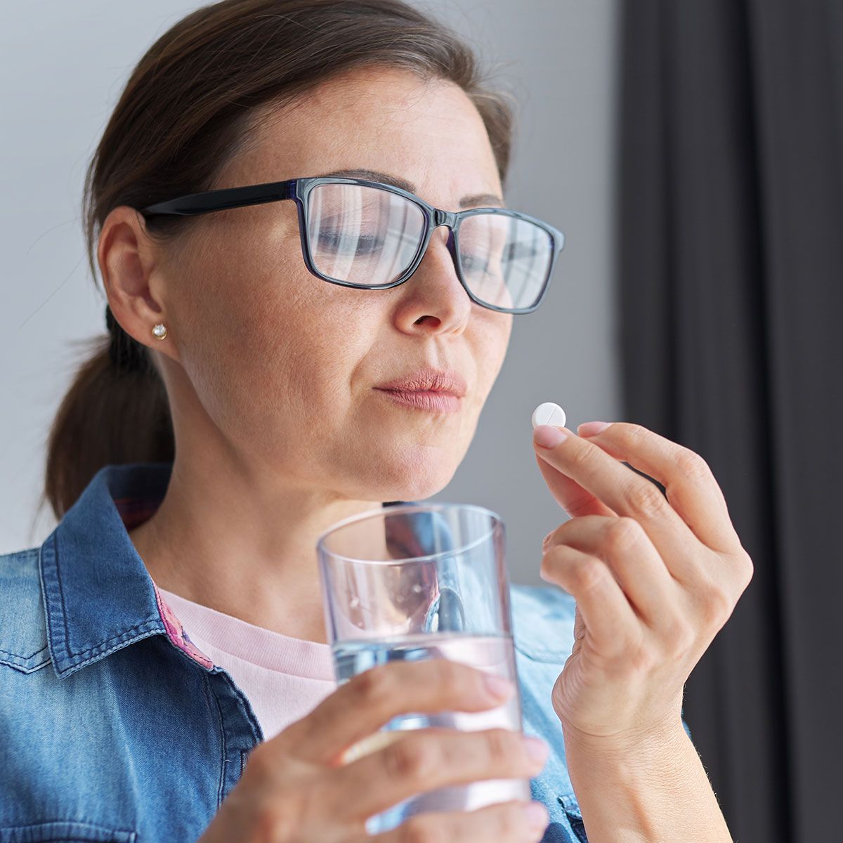 woman taking supplement