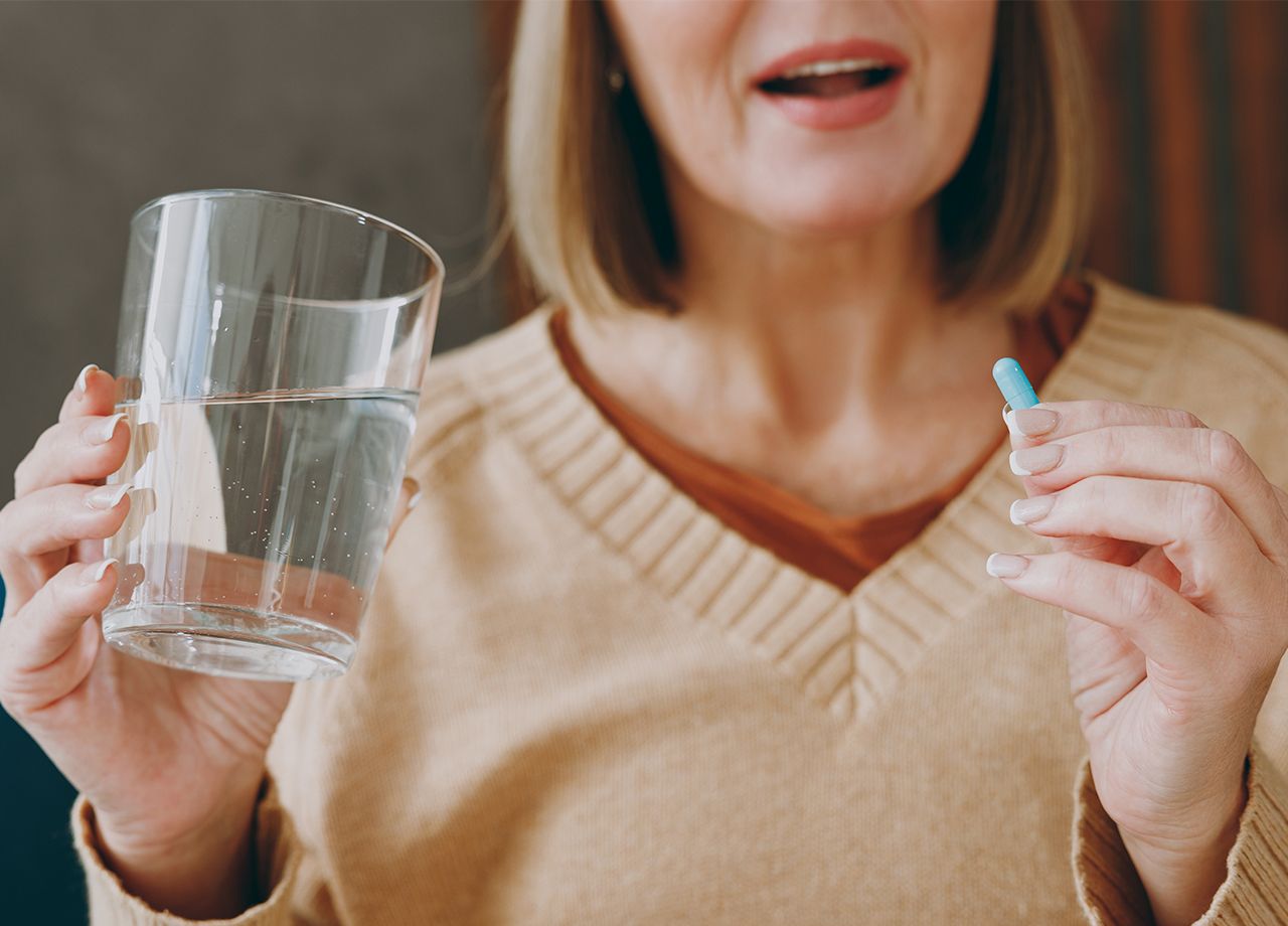 woman-taking-vitamin