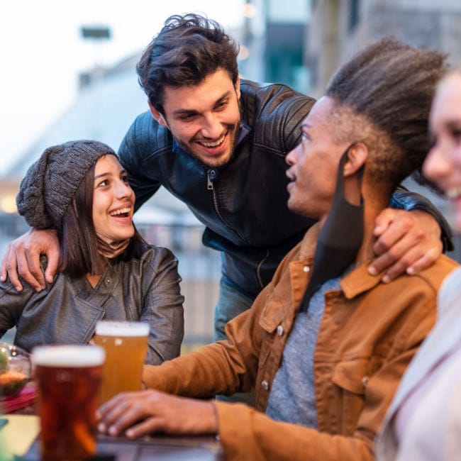 friends laughing and drinking beer