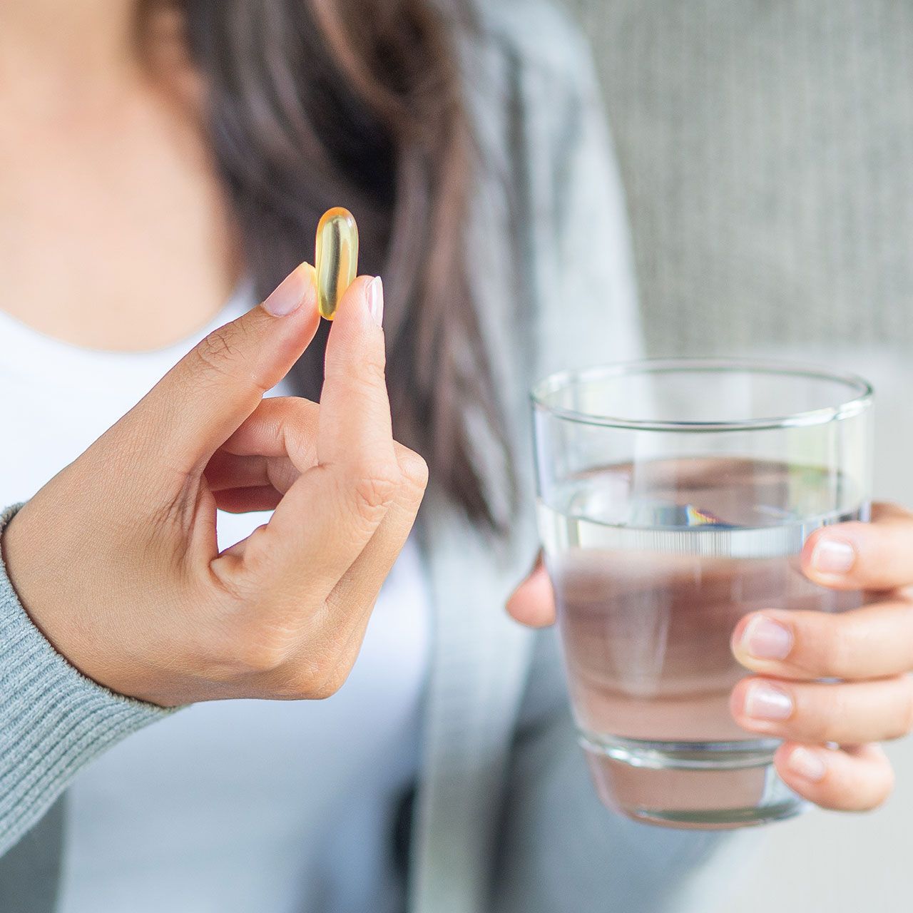 woman-taking-vitamin