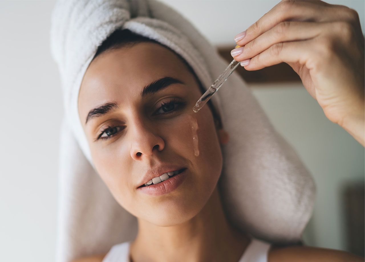 woman-applying-skincare