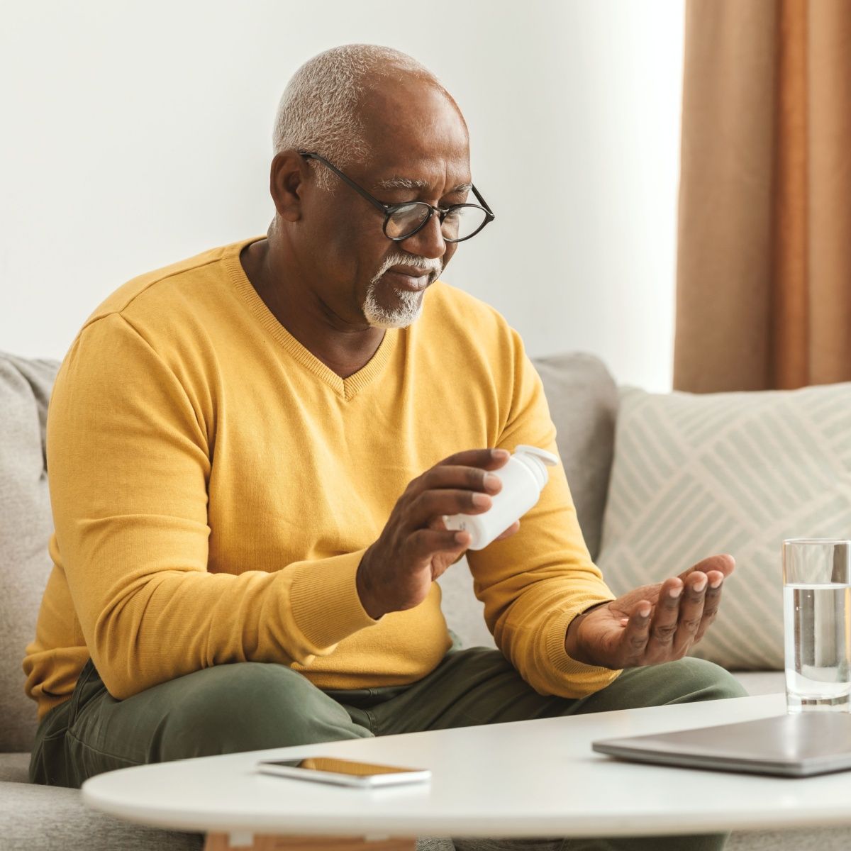 man taking supplements