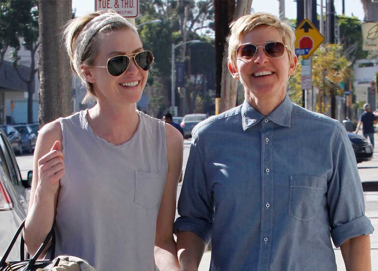 Ellen DeGeneres and Portia de Rossi walking hand in hand in West Hollywood