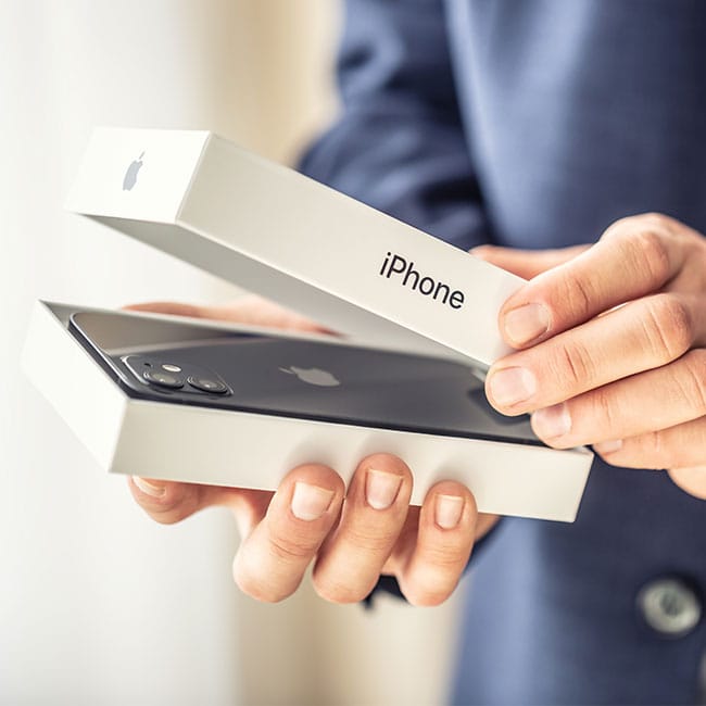 man-opening-new-iphone