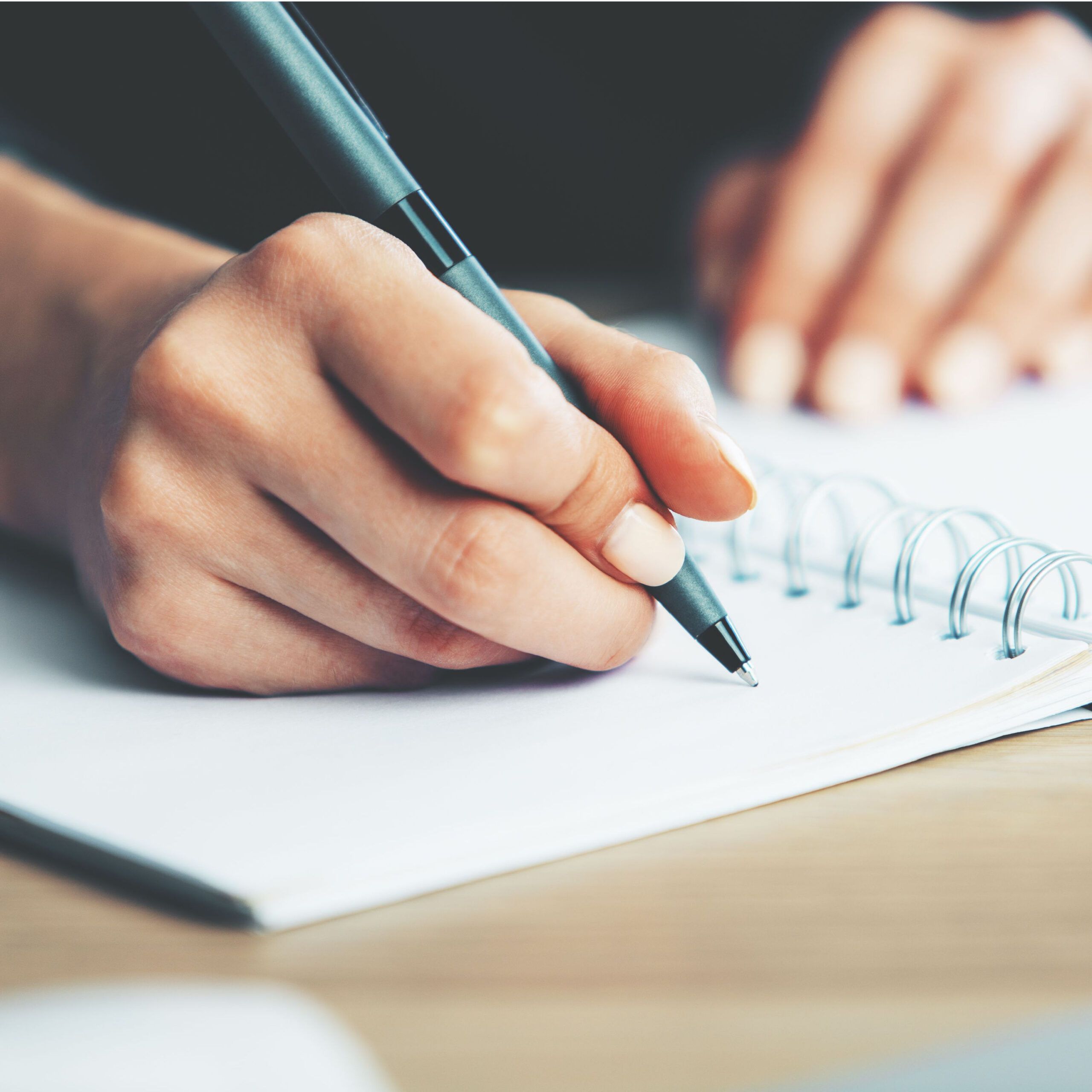 woman writing in journal