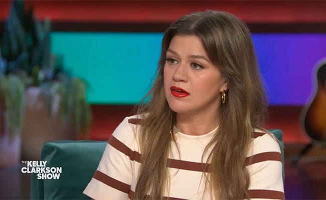 Kelly Clarkson wearing a striped dress on The Kelly Clarkson Show