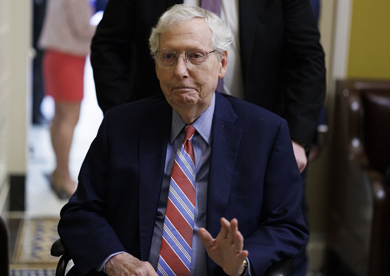 Mitch McConnell departs a meeting