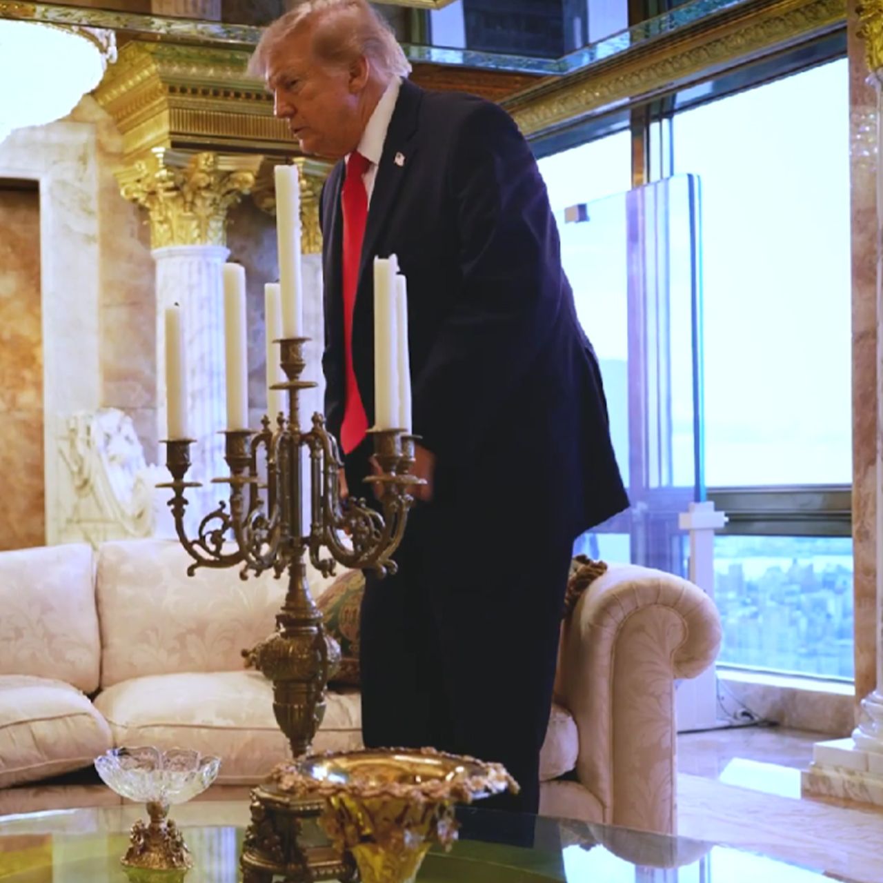 Donald Trump sitting on a pillow at Trump Tower