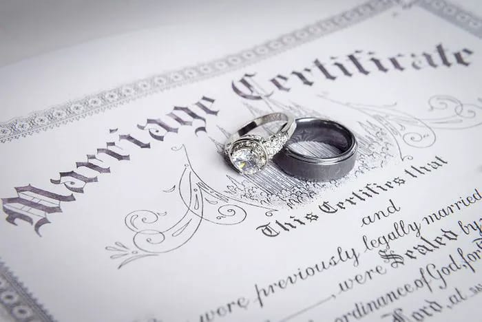 Check on the marriage license.