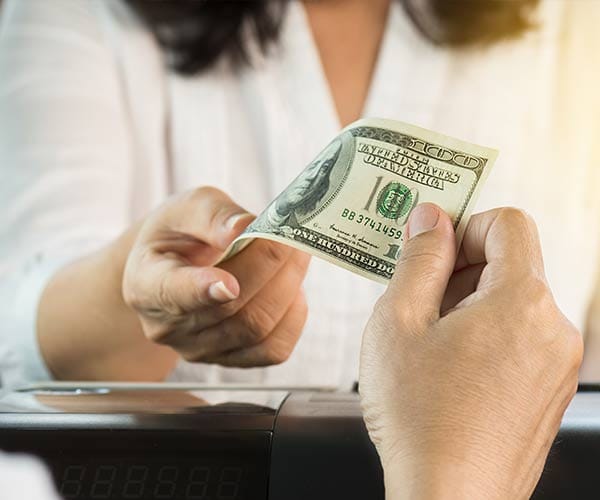 Woman handing over money