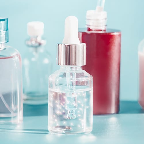 assorted skincare serum bottles