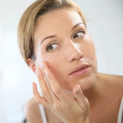 woman touching face