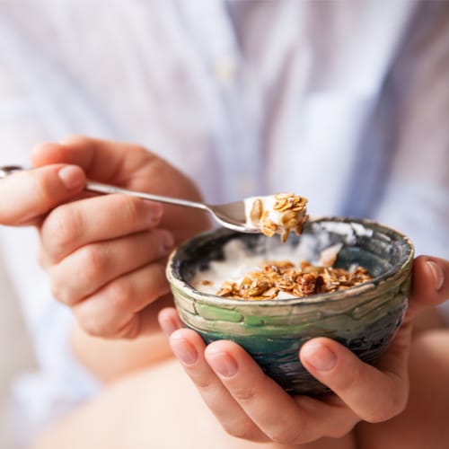 woman eating granola