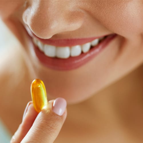 woman taking supplement