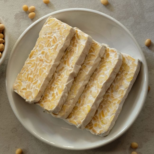 sliced tempeh in shallow bowl
