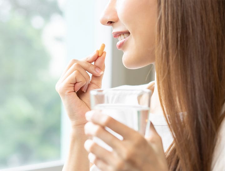 woman-taking-a-supplement