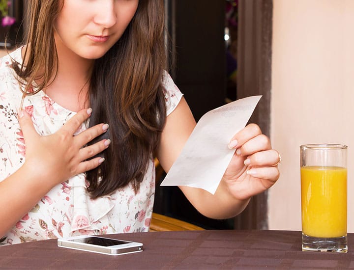 Woman shocked by food bill at restaurant