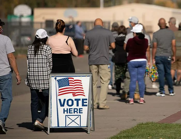 People standing in line to vote in election