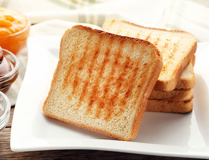 Plate of white toasted bread
