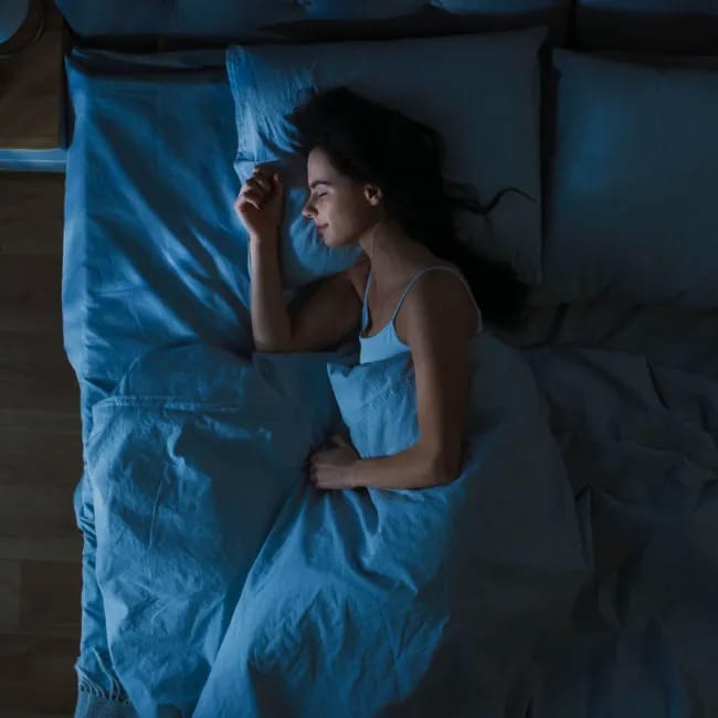 woman sleeping soundly in bed