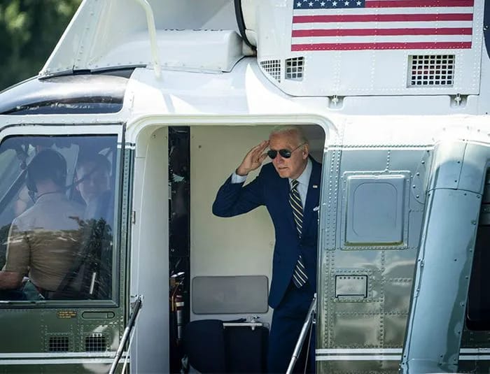 Joe Biden saluting on Marine One helicopter