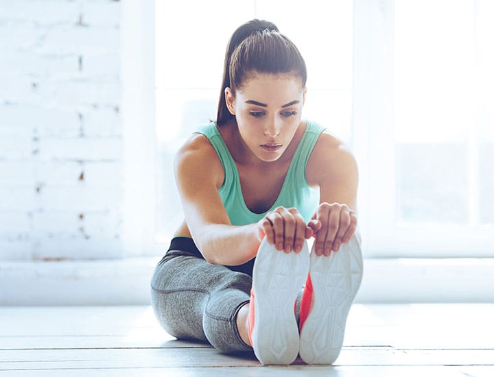 Woman stretching after workout