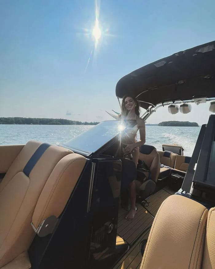 Olivia Culpo driving a boat Instagram
