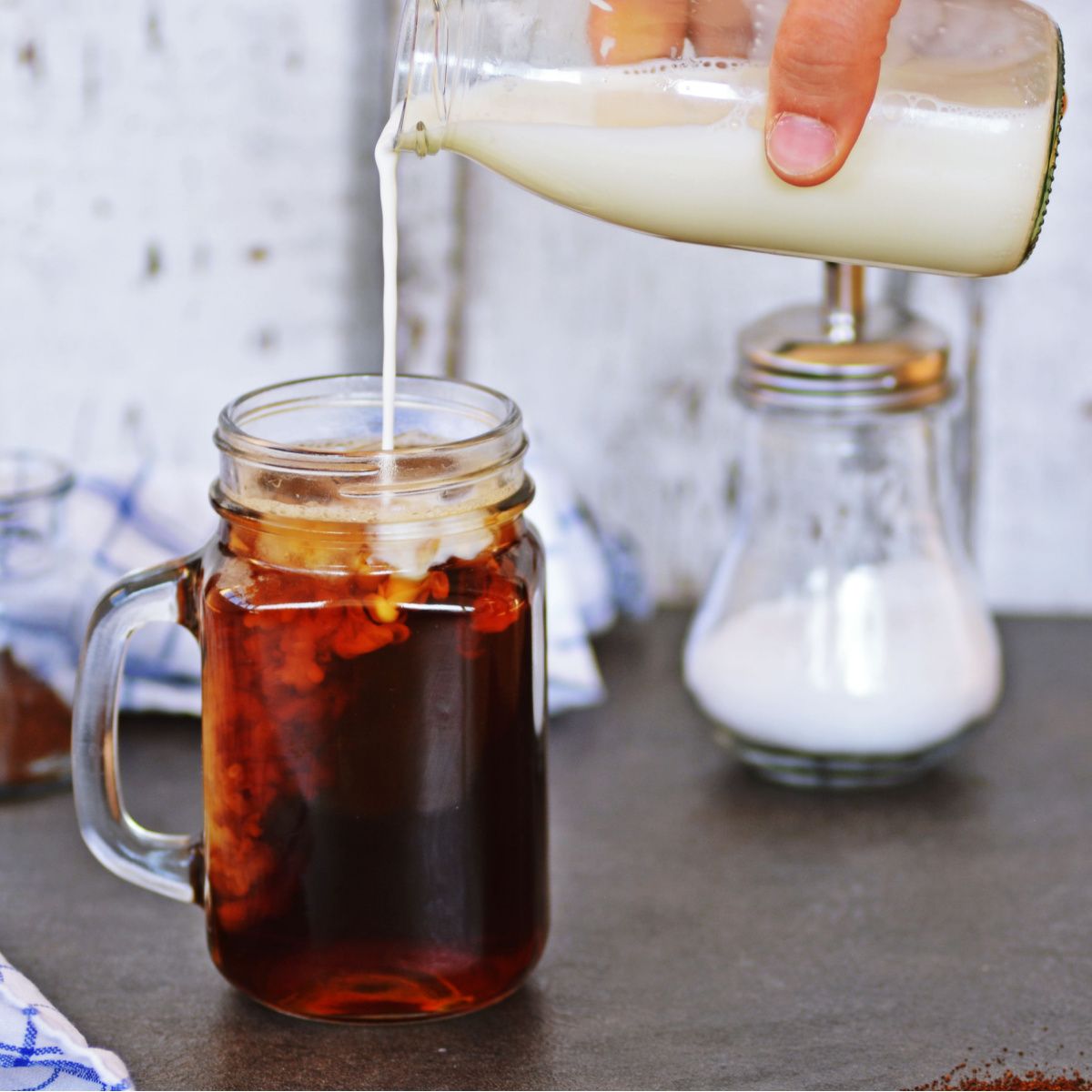 coffee creamer poured into a glass