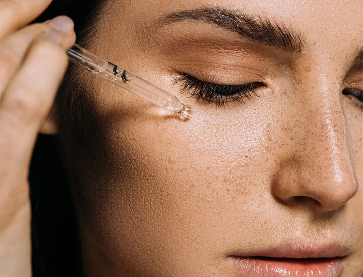 woman-applying-skincare