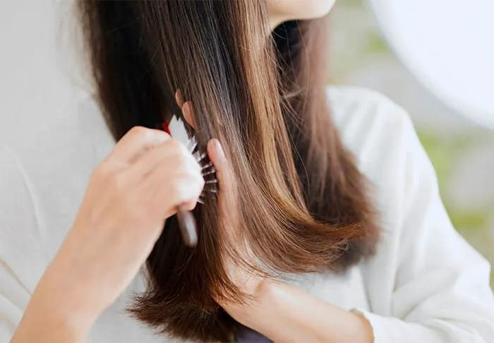 woman-brushing-hair