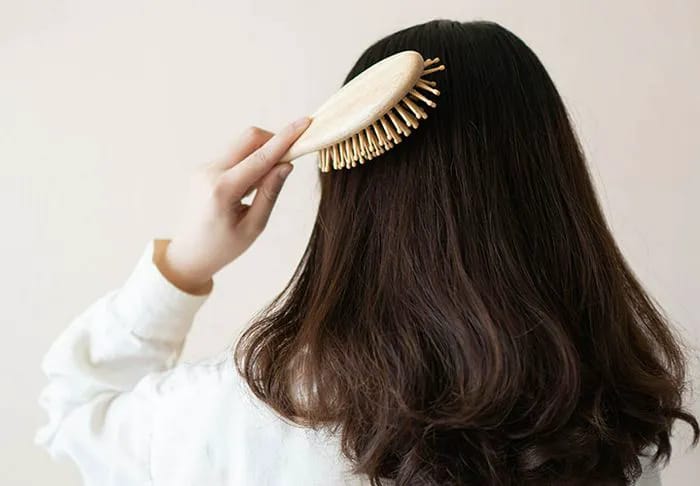 woman-brushing-hair