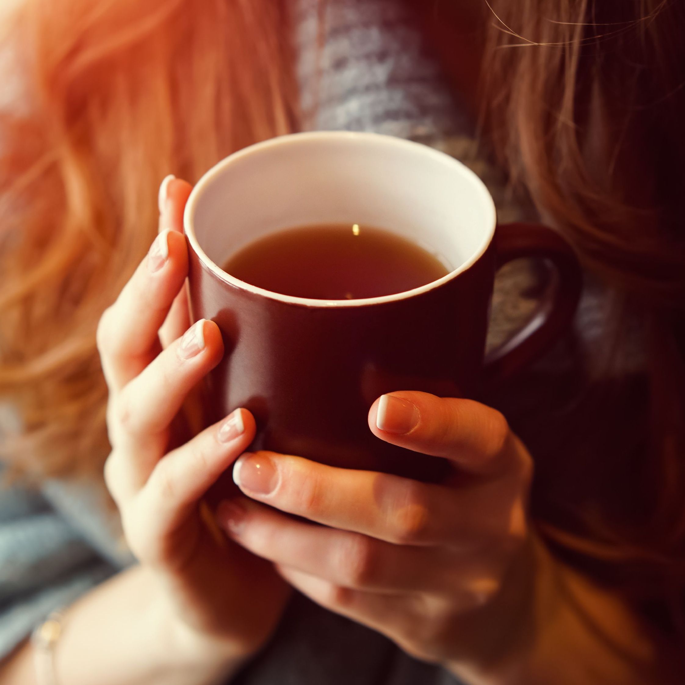 woman holding tea