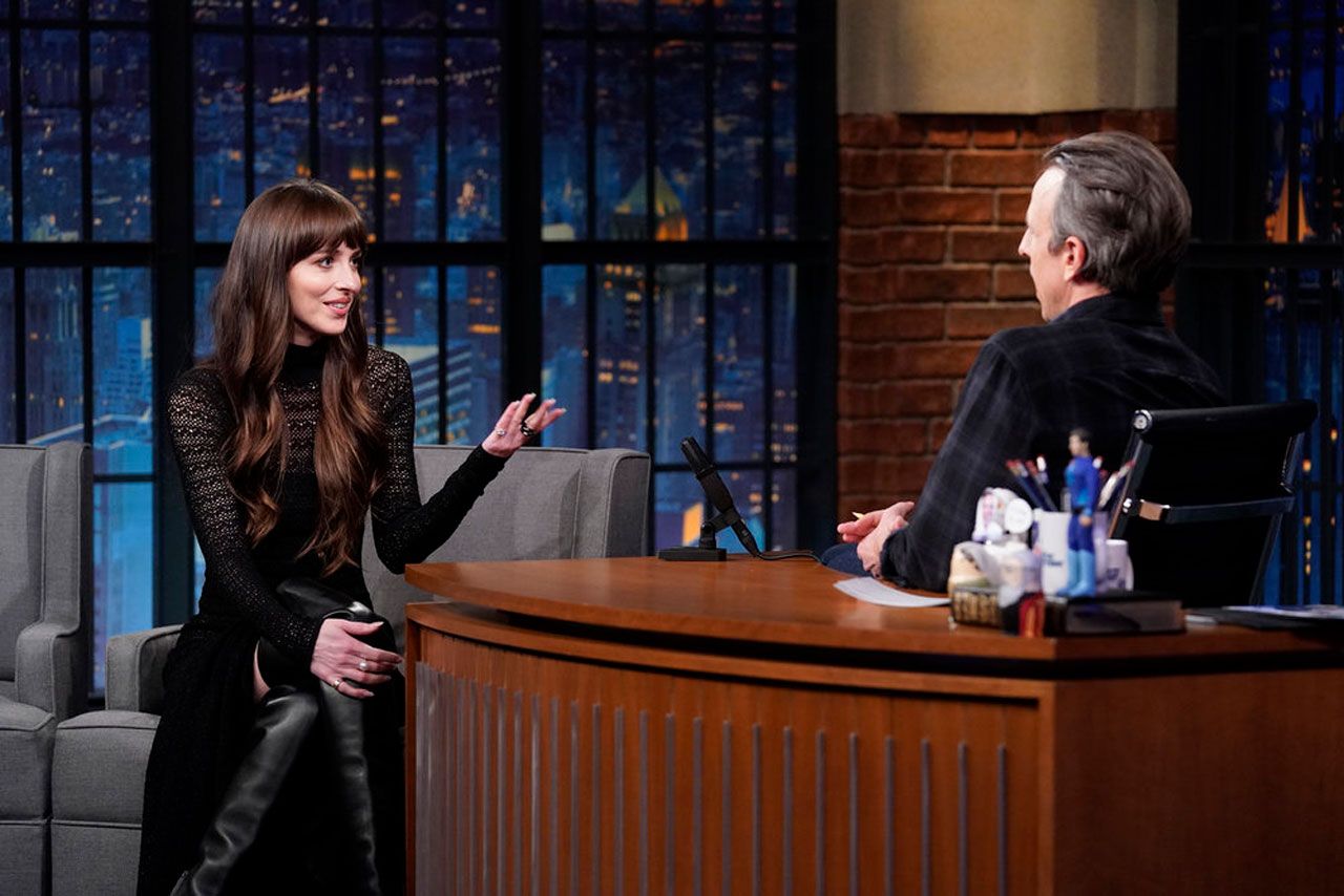 dakota johnson with seth meyers on the late night show february 7