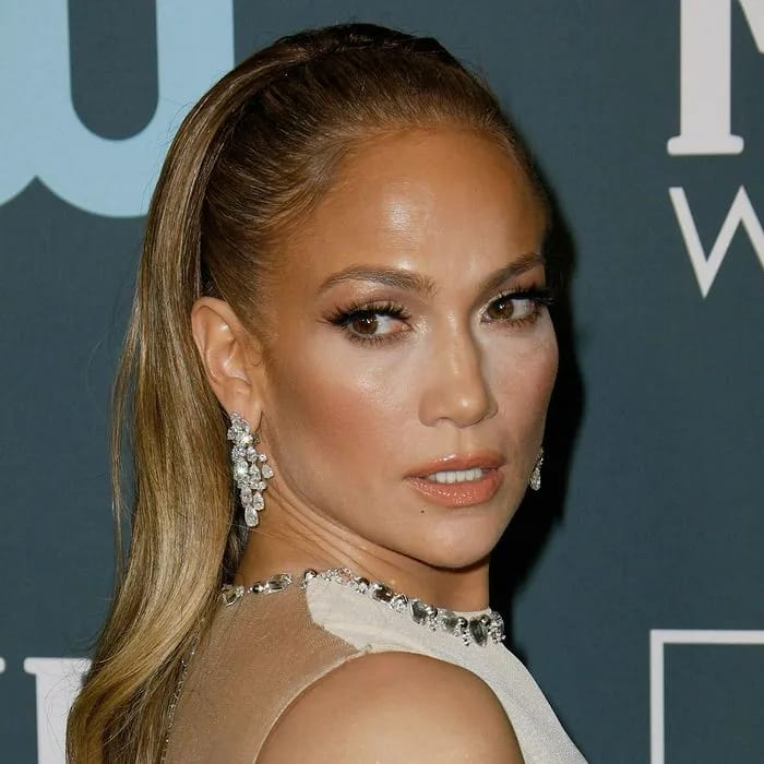 Jennifer Lopez showcasing a sleek ponytail hairstyle.