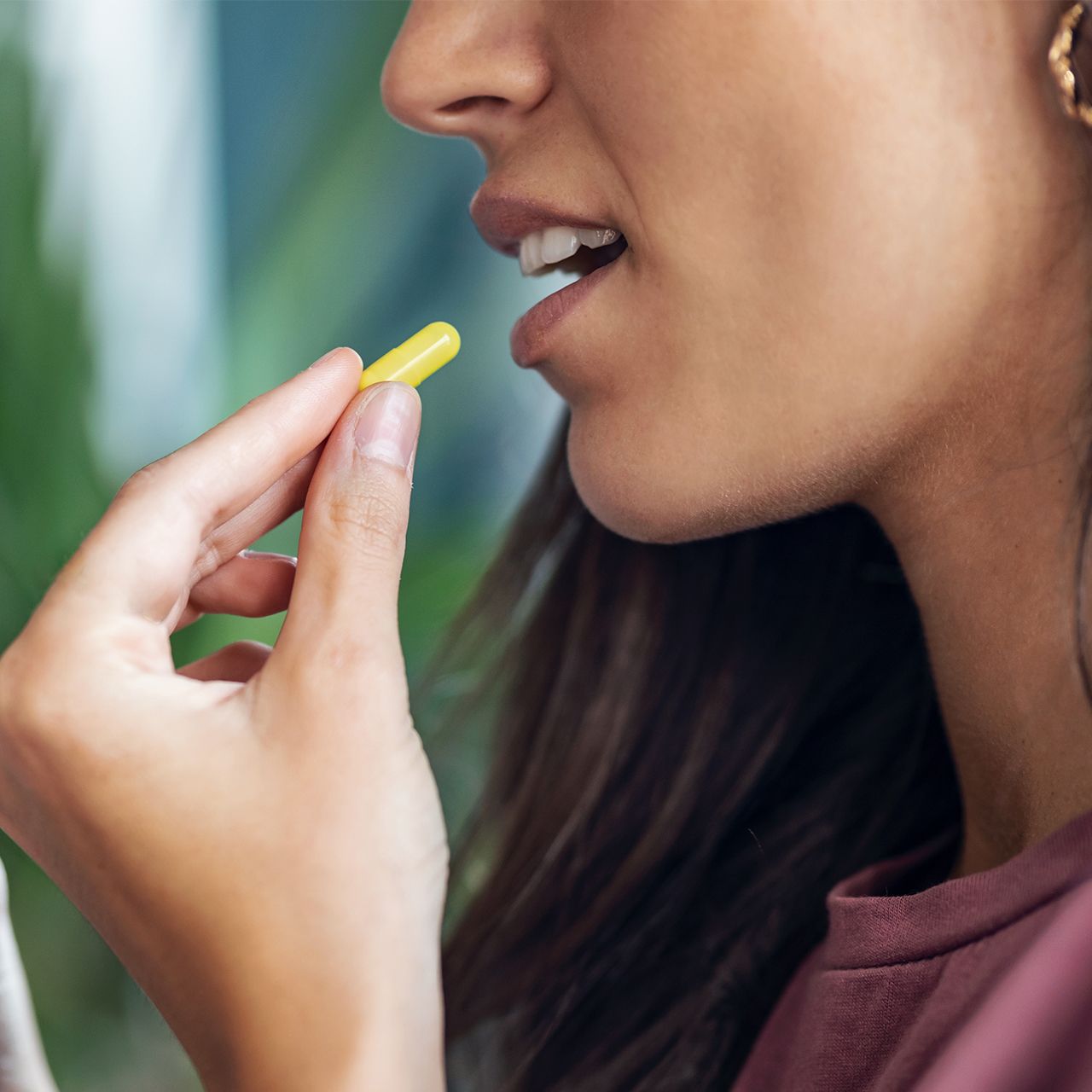 woman-taking-vitamin