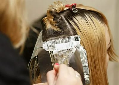 bleaching roots at a hair salon