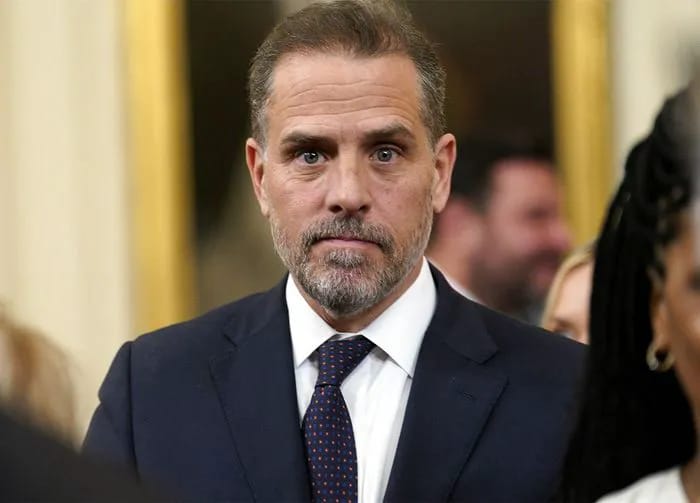 Hunter Biden navy blue suit in east room at the white house