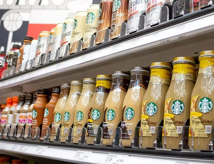 Prepackaged sugary coffee drinks on display.