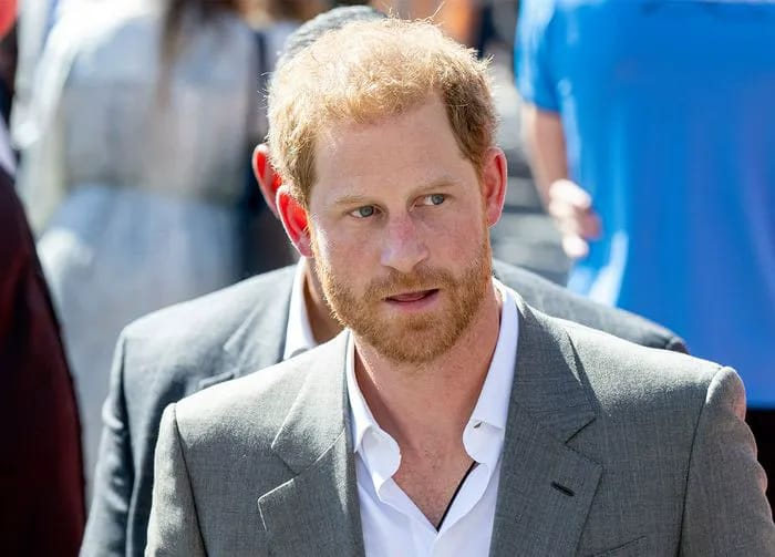 Prince Harry wearing a gray blazer