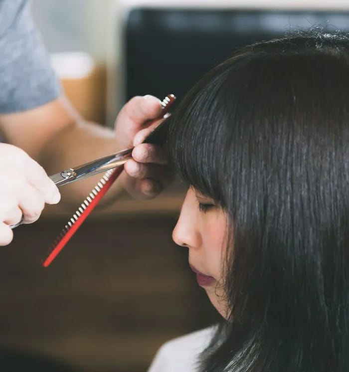 woman getting haircut