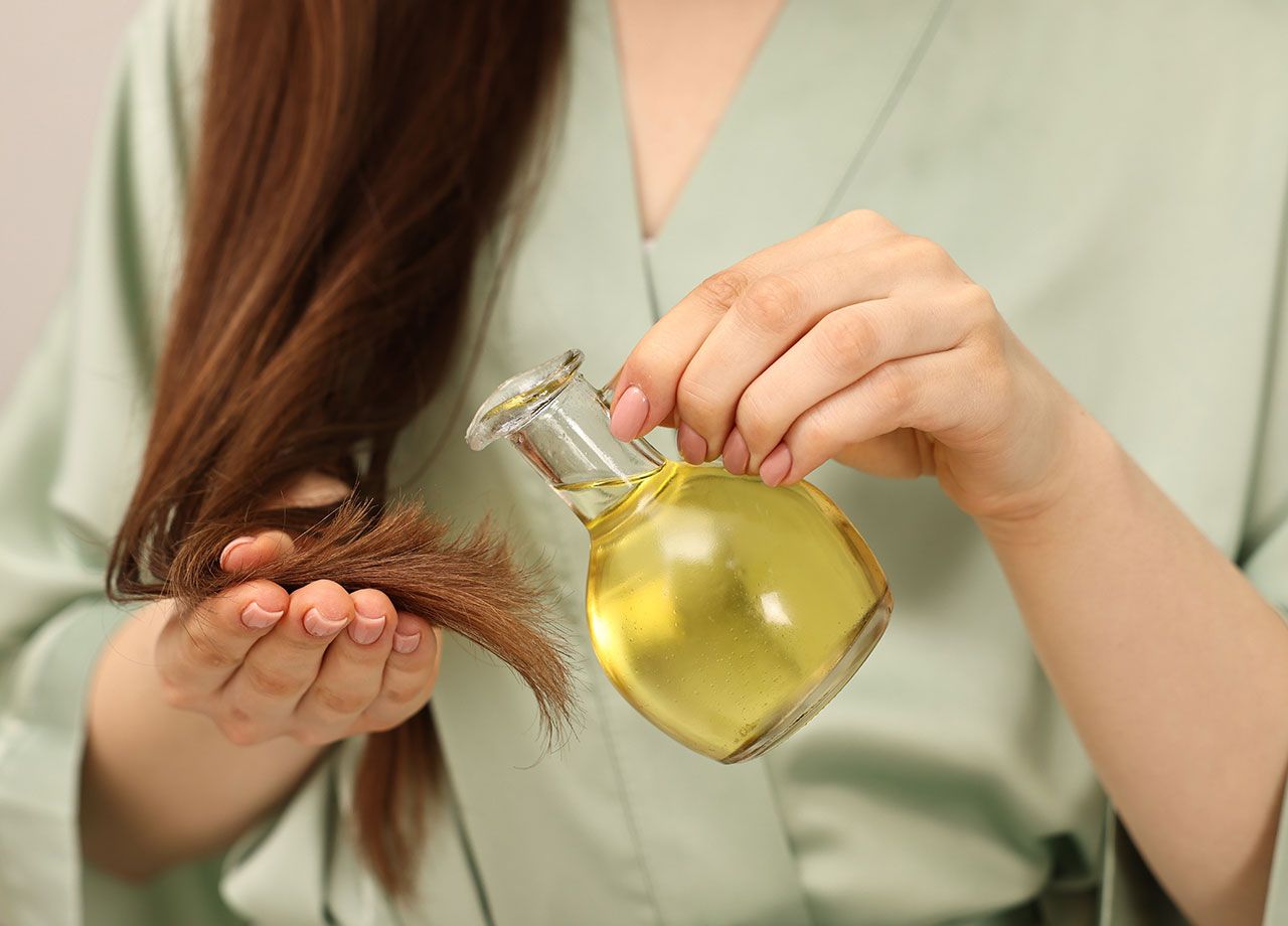 woman-pouring-olive-oil