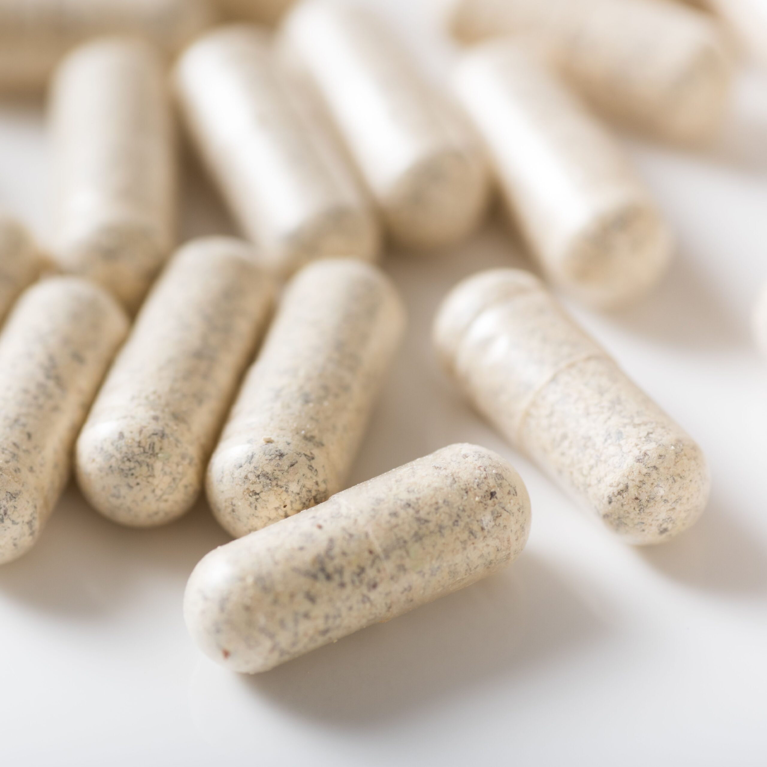 white capsules on counter