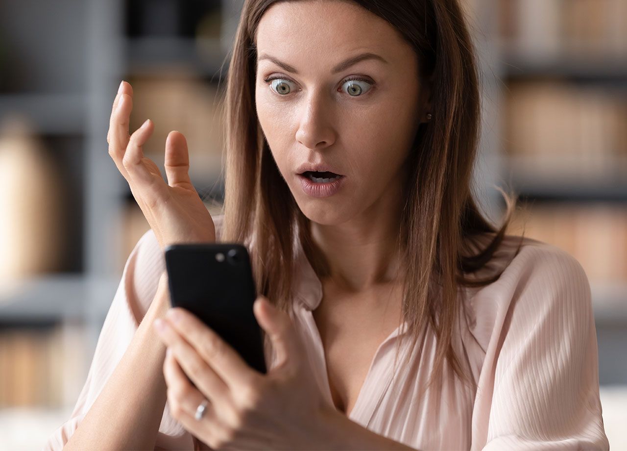 woman-shocked-phone-hacked