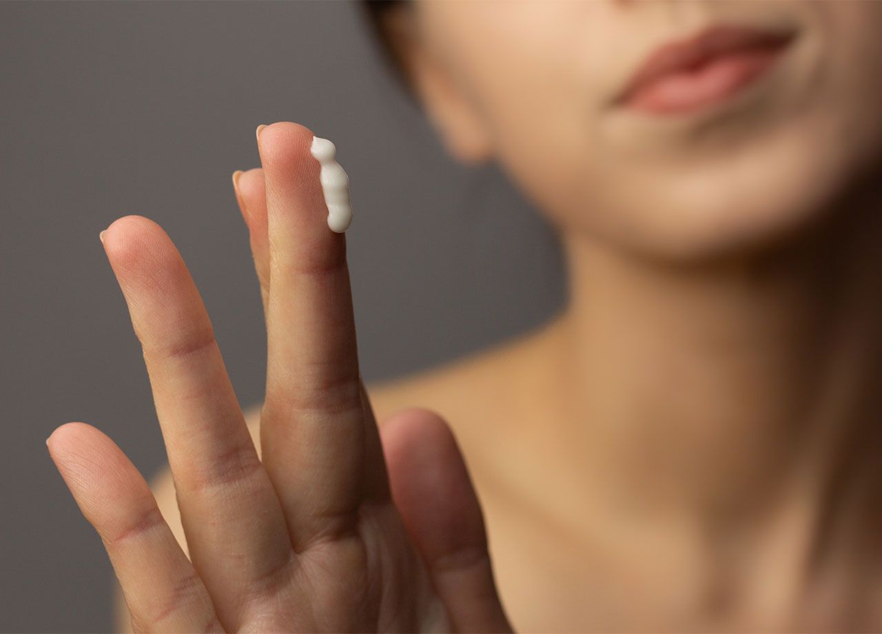 woman-applying-cream